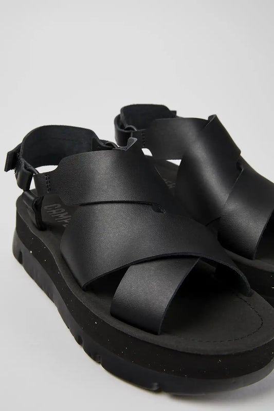 Oruga Up Black leather sandals for women