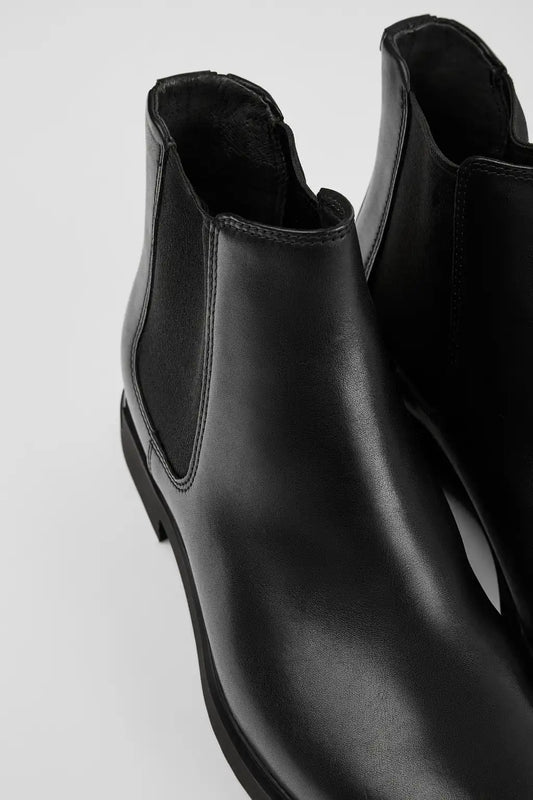 Iman Black Leather Ankle Boots for Women.
